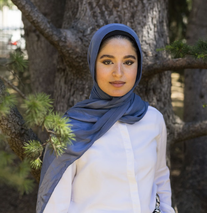 Portrait of Nour Elassy in front of a tree